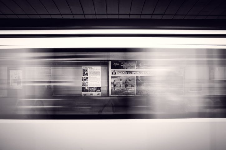 passing-subway-at-subway-station Ads visible through windows of a speeding train